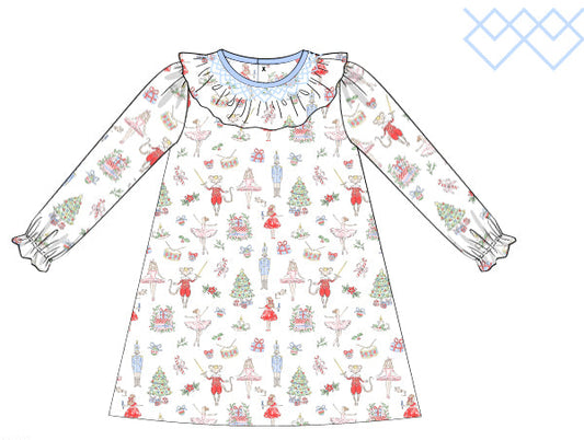Children's dress with a nutcrackers pattern on a white background and smocked