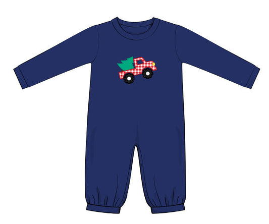 Navy blue baby romper with a red truck and green tree design on a white background
