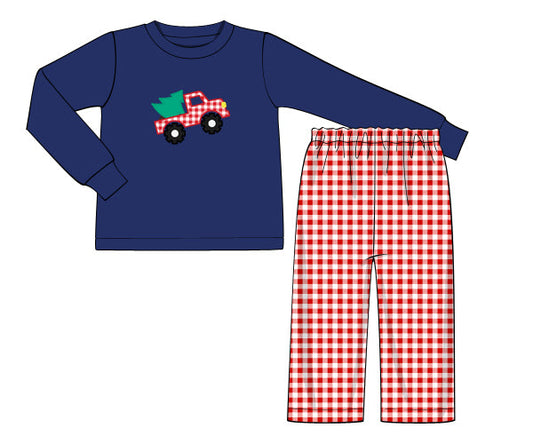 Children's pajama set with blue long-sleeve shirt and red checkered pants on a white background.