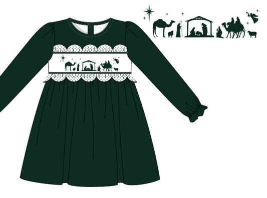 Green dress with nativity scene design on a white background