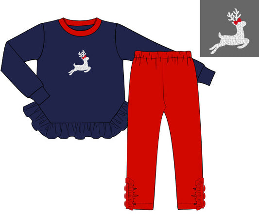 Children's navy long-sleeve top and red pants with a reindeer design on a white background.