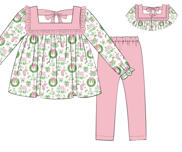 Children's outfit with floral top and pink pants on a white background