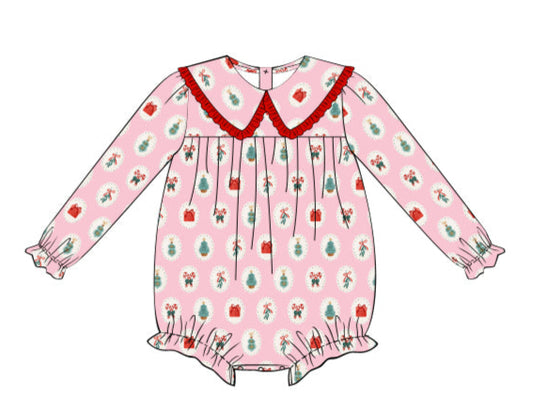 Children's pink dress with floral pattern and red collar on a white background