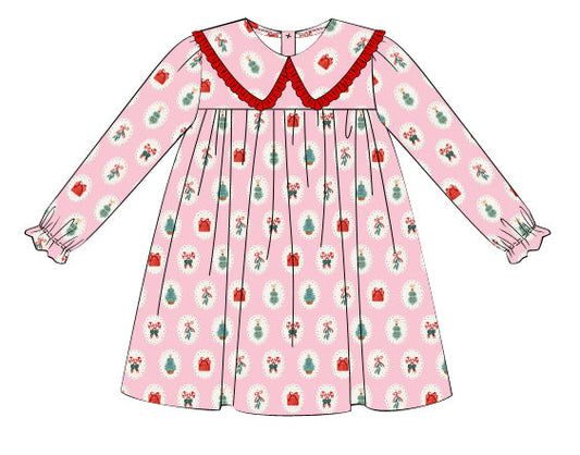 Children's dress with Christmas-themed pattern on a white background