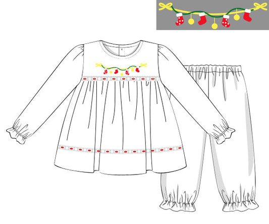 Children's dress and pants with festive trim on a white background