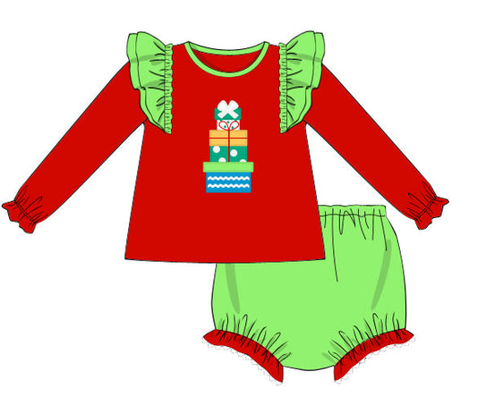 Red shirt with green ruffled sleeves and green pants on a white background
