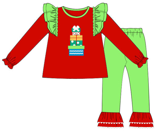 Red and green children's outfit with a Christmas-themed design on a white background