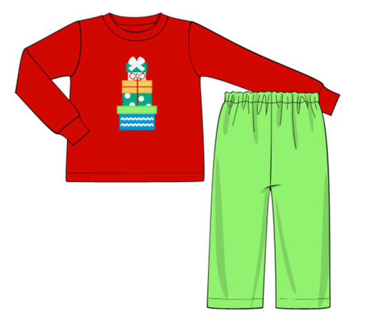 Red long-sleeve shirt with festive design and green pants on a white background